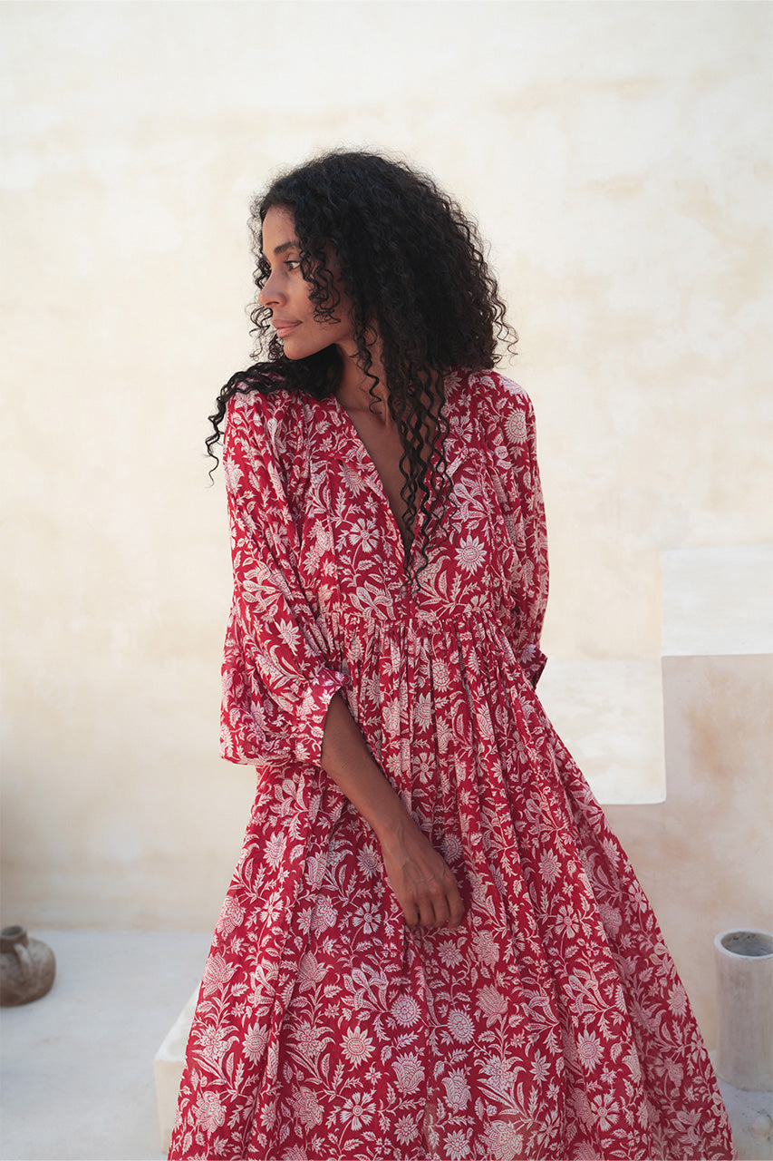 Daughters of India Kyra Midi Dress in Saffron — against terracotta wall, hand screen print cotton