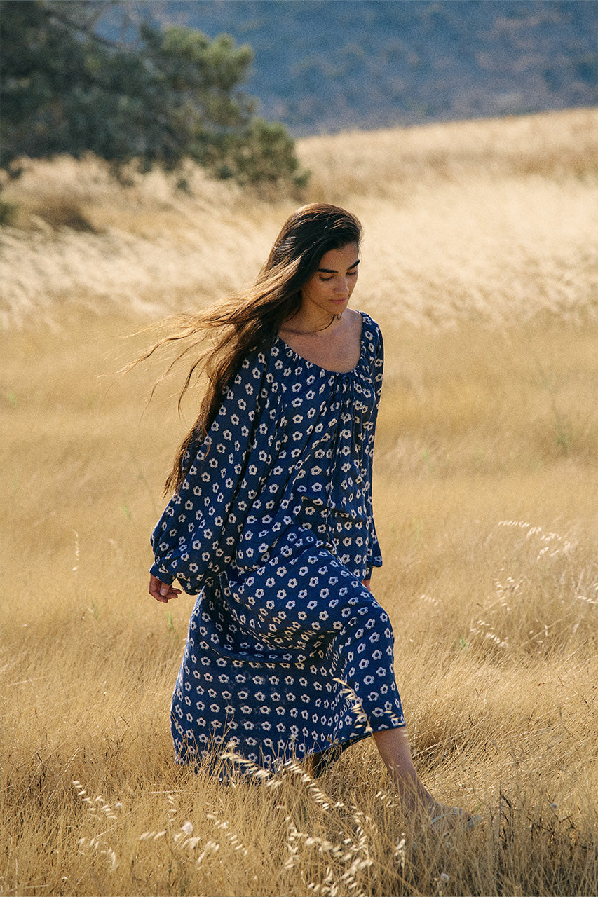 Zahra Midi Dress Indigo — flowing silhouette in open field, ethical hand block print | Daughters of India